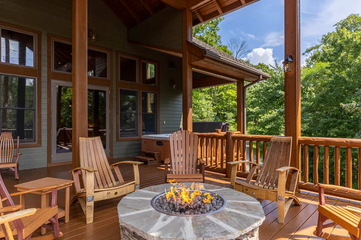 An inviting fire pit area with wooden chairs nestled amid lush greenery. The space feels intimate and perfectly suited for sunset views, nature walks, and relaxed outdoor gatherings.